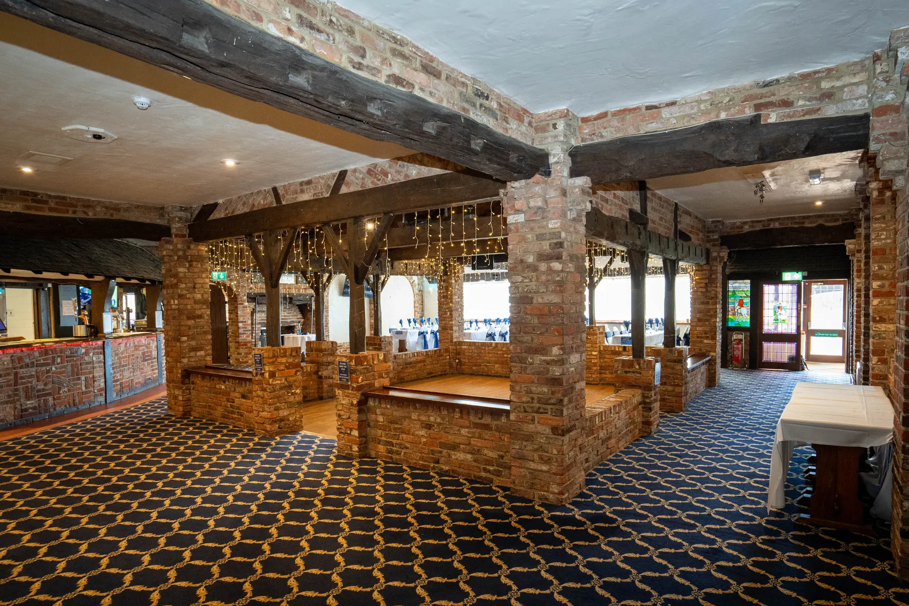 The Elizabethan Restaurant, with its brick pillars, beams and dance floor