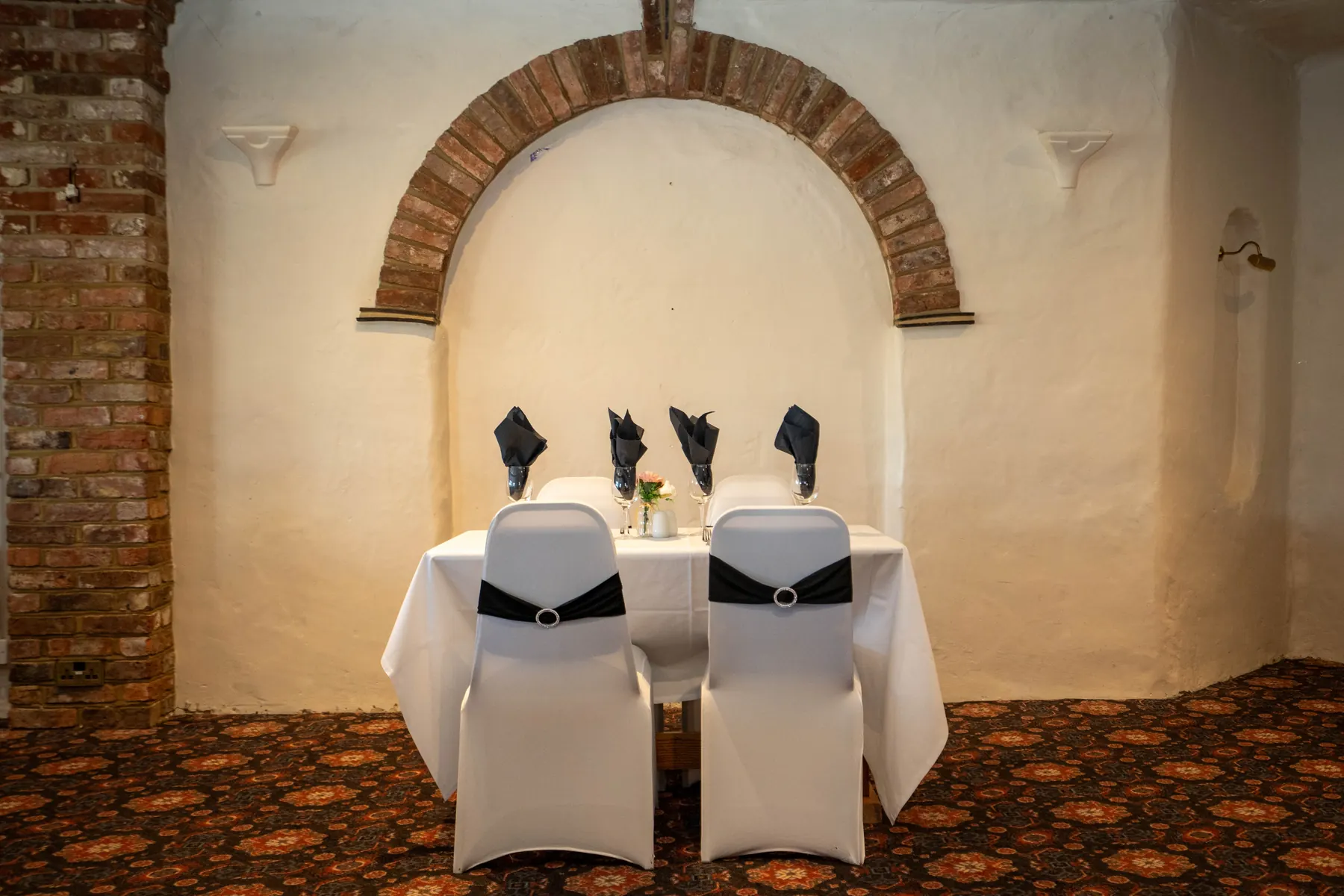 A top table under a brick arch in the Elizabethan Restaurant